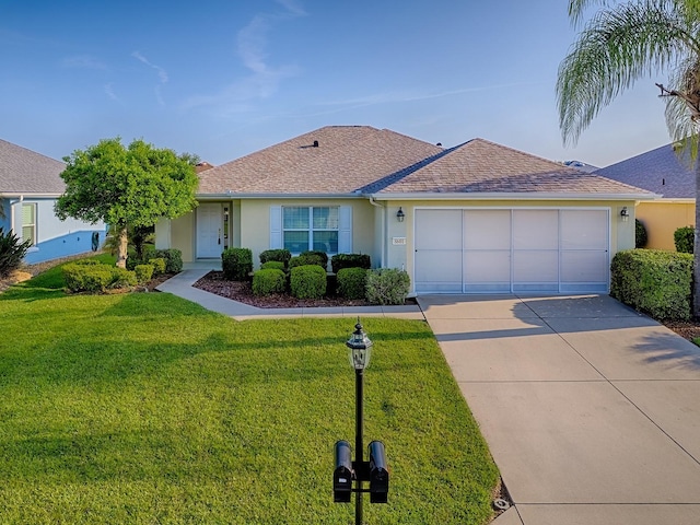 8601 SE 133rd St, Summerfield, FL 34491 - single story home featuring stucco siding, driveway, an attached garage, a front lawn, and roof with shingles