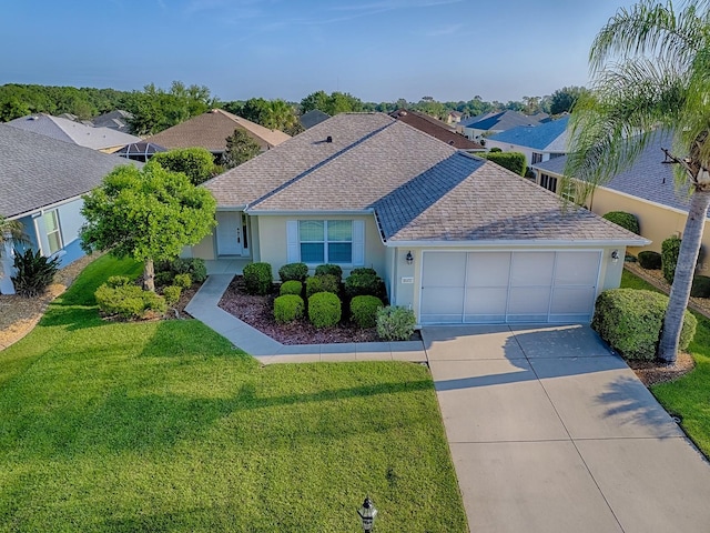 8601 SE 133rd St, Summerfield, FL 34491 - single story home featuring driveway, a shingled roof, an attached garage, a front lawn, and stucco siding