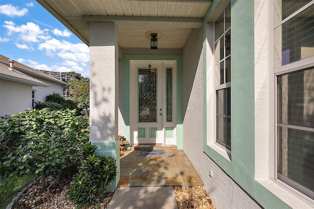 5604 Gulf Stream St, Tavares, FL 32778 - doorway to property featuring stucco siding and a porch