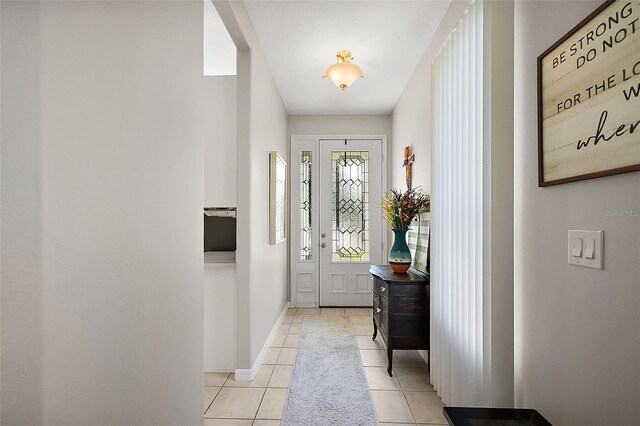 5604 Gulf Stream St, Tavares, FL 32778 - foyer featuring light tile patterned floors and baseboards