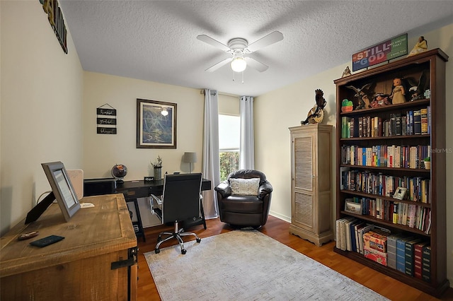 5604 Gulf Stream St, Tavares, FL 32778 - office space featuring ceiling fan, wood finished floors, and a textured ceiling