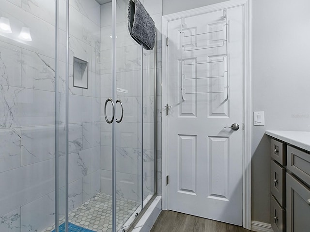 1722 Moreno Pl, The Villages, FL 32159 - full bath with a shower stall, wood finished floors, and vanity