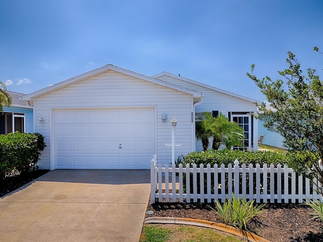1722 Moreno Pl, The Villages, FL 32159 - ranch-style home with a garage, concrete driveway, and fence