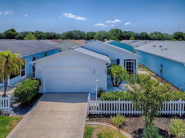 1722 Moreno Pl, The Villages, FL 32159 - ranch-style house with fence, concrete driveway, and a garage