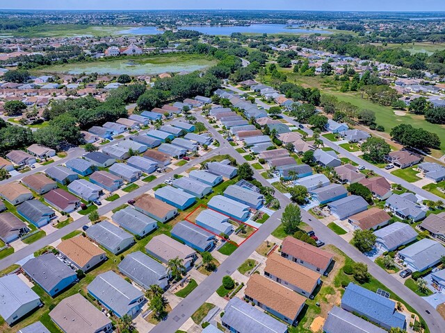 1722 Moreno Pl, The Villages, FL 32159 - aerial view of property and surrounding area with a large body of water and nearby suburban area