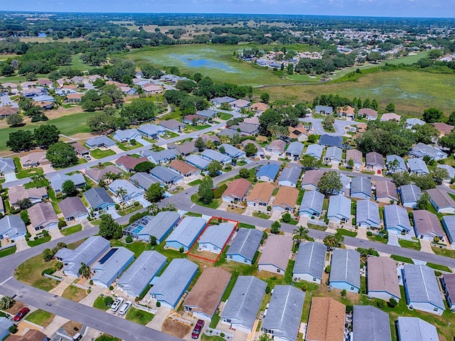 1722 Moreno Pl, The Villages, FL 32159 - aerial view of property and surrounding area with a large body of water and nearby suburban area