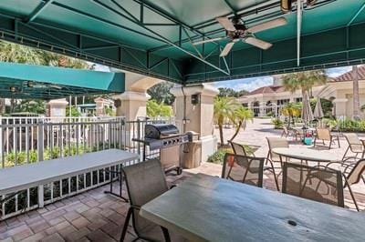 view of patio featuring a ceiling fan and a grill