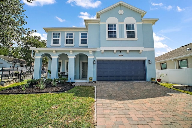 1155 Dora Parc Ln, Mount Dora, FL 32757 - view of front facade with a porch, decorative driveway, stucco siding, and an attached garage