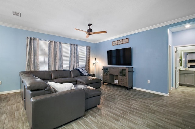 1155 Dora Parc Ln, Mount Dora, FL 32757 - living area with baseboards, a ceiling fan, wood finished floors, and ornamental molding