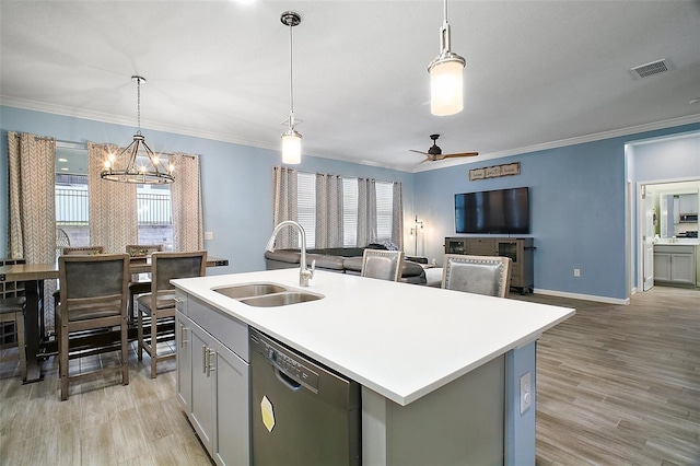 1155 Dora Parc Ln, Mount Dora, FL 32757 - kitchen with a sink, dishwasher, light countertops, a center island with sink, and ornamental molding