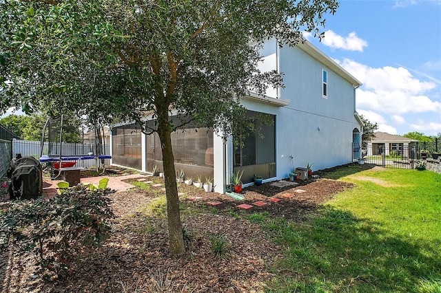 1155 Dora Parc Ln, Mount Dora, FL 32757 - view of yard with a trampoline and a sunroom