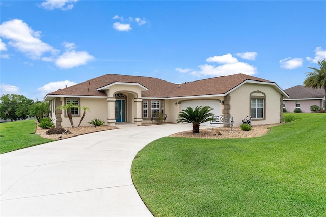 5400 Saddleback Ct, Lady Lake, FL 32159 - view of front of home with stucco siding, driveway, an attached garage, and a front yard