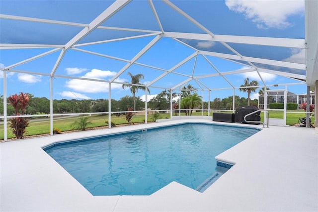 5400 Saddleback Ct, Lady Lake, FL 32159 - swimming pool featuring a patio, a lanai, a lawn, and grilling area