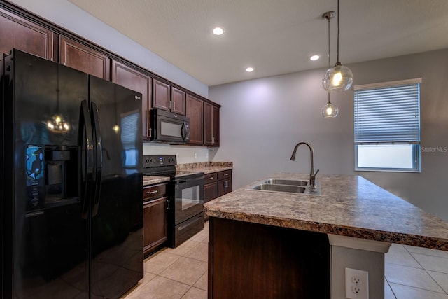 3194 Bayou Ln, Tavares, FL 32778 - kitchen featuring black appliances, a sink, light tile patterned floors, decorative light fixtures, and dark brown cabinetry