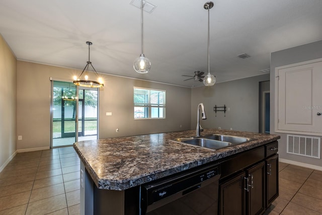 3194 Bayou Ln, Tavares, FL 32778 - kitchen featuring dishwasher, a sink, light tile patterned flooring, dark countertops, and an island with sink
