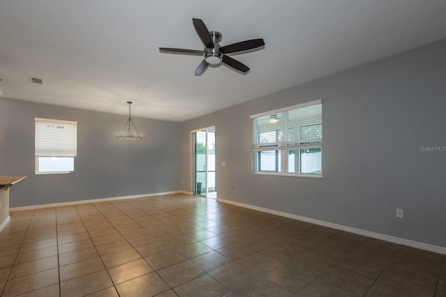 3194 Bayou Ln, Tavares, FL 32778 - unfurnished room featuring ceiling fan, tile patterned flooring, and baseboards