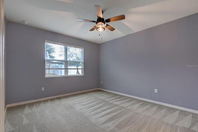 3194 Bayou Ln, Tavares, FL 32778 - carpeted empty room with a ceiling fan, baseboards, and a smoke detector