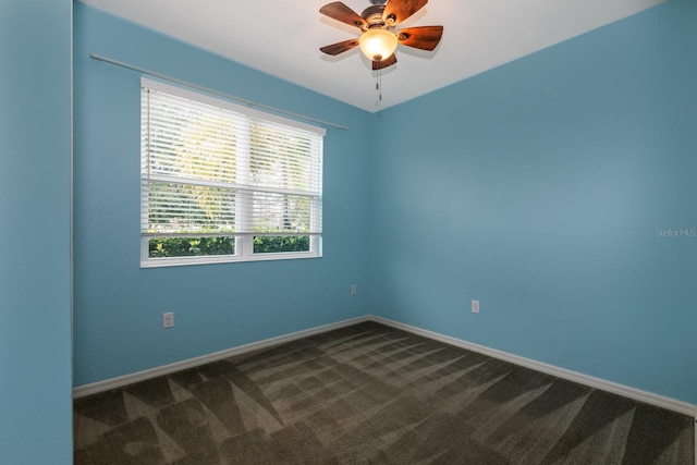 3194 Bayou Ln, Tavares, FL 32778 - empty room with dark carpet, ceiling fan, and baseboards