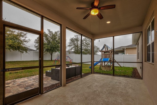 3194 Bayou Ln, Tavares, FL 32778 - unfurnished sunroom featuring ceiling fan and an outdoor living space