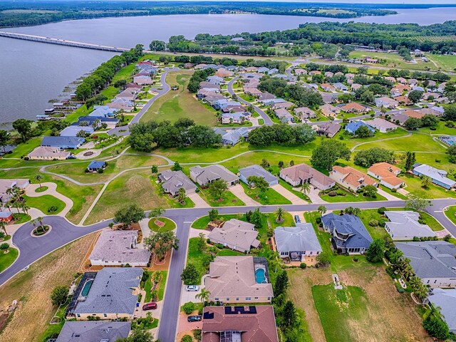 aerial overview of property's location with nearby suburban area and a nearby body of water