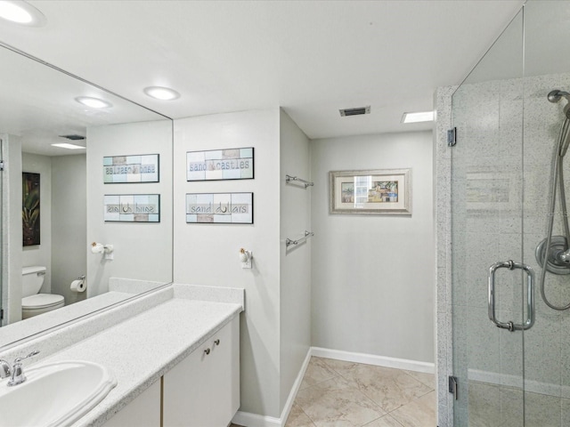 full bath featuring baseboards, a shower stall, marble look tiles, vanity, and toilet