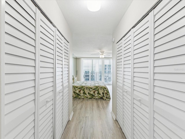 corridor with light wood-style flooring