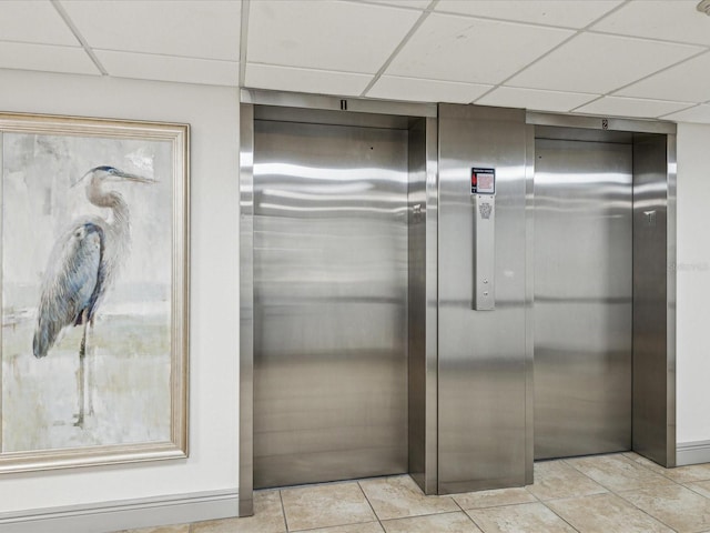 elevator with a paneled ceiling