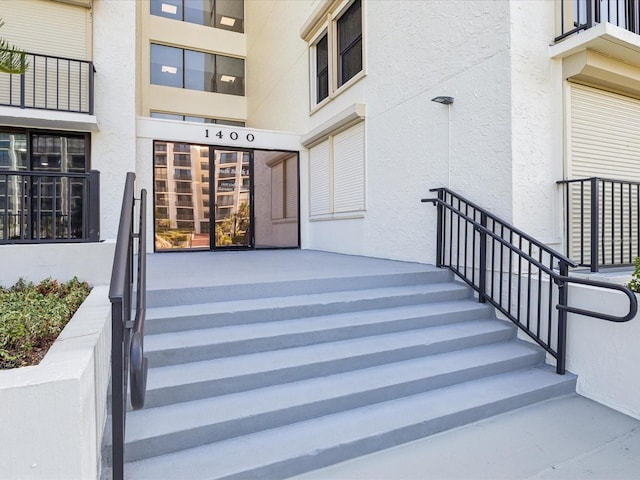 property entrance featuring stucco siding