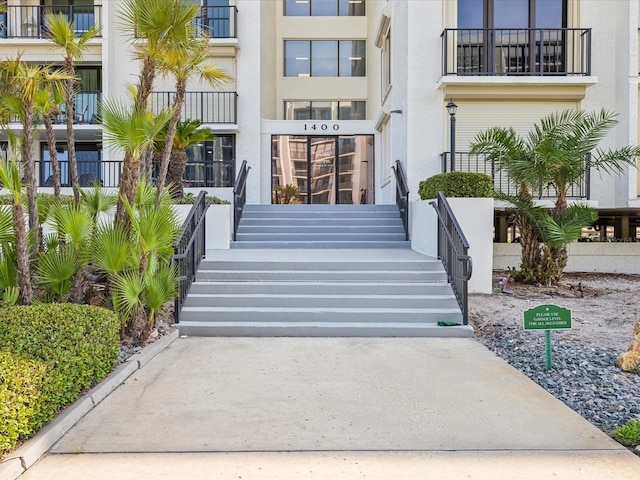 doorway to property with stucco siding