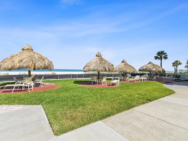 view of grassy yard featuring a water view