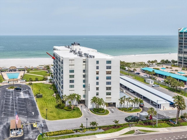 aerial view of expansive beach and apartment complex / building