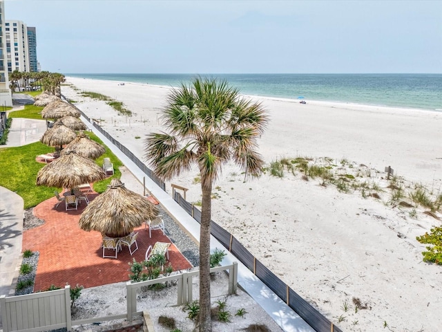 water view featuring nearby beach and a gazebo