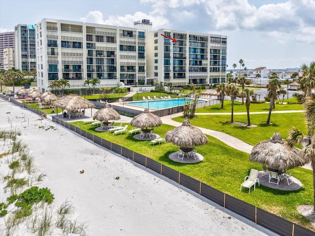 view of property's community with a yard