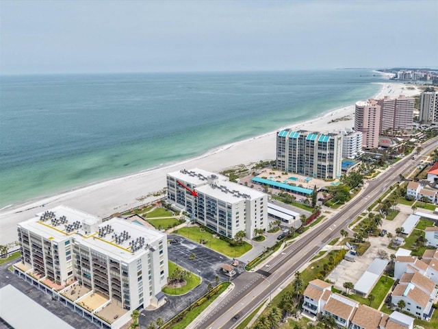 view of urban area with expansive beach and apartment complex