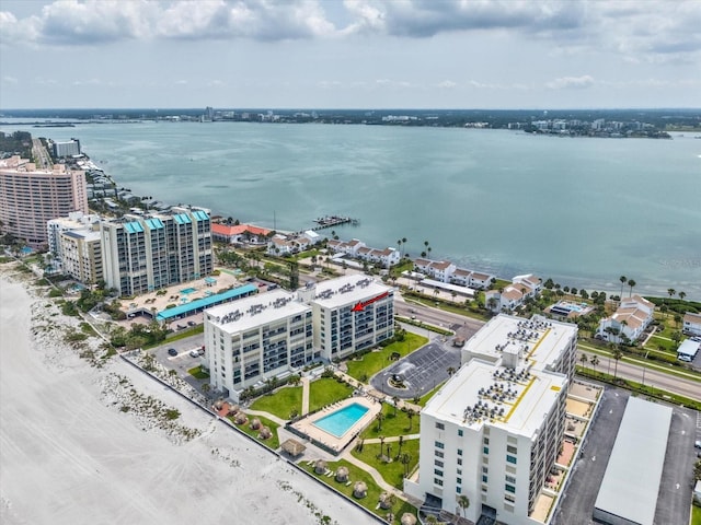 bird's eye view of a nearby body of water and a pool