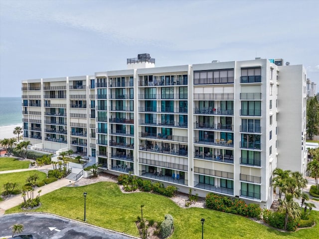 view of apartment building / complex featuring a water view
