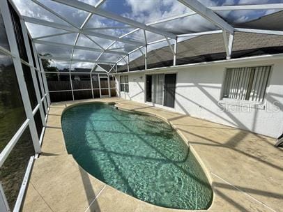 3041 Bloomsbury Dr, Kissimmee, FL 34747 - view of pool with a patio area and a lanai