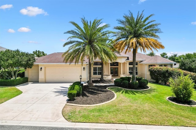 1123 Barnacle Ter, The Villages, FL 32162 - ranch-style house with a garage, driveway, stucco siding, and a front yard