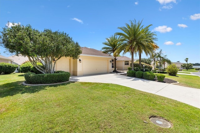 1123 Barnacle Ter, The Villages, FL 32162 - view of front of home with a garage, concrete driveway, a front yard, and stucco siding