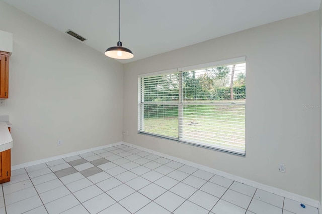 11442 Beggs Ct, Clermont, FL 34711 - unfurnished dining area with healthy amount of natural light, baseboards, and light tile patterned flooring
