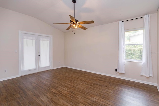 11442 Beggs Ct, Clermont, FL 34711 - spare room featuring ceiling fan, lofted ceiling, dark wood-type flooring, and baseboards