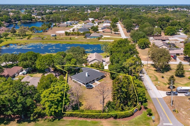 11442 Beggs Ct, Clermont, FL 34711 - aerial perspective of suburban area with a nearby body of water, property parcel outlined, and a tree filled landscape