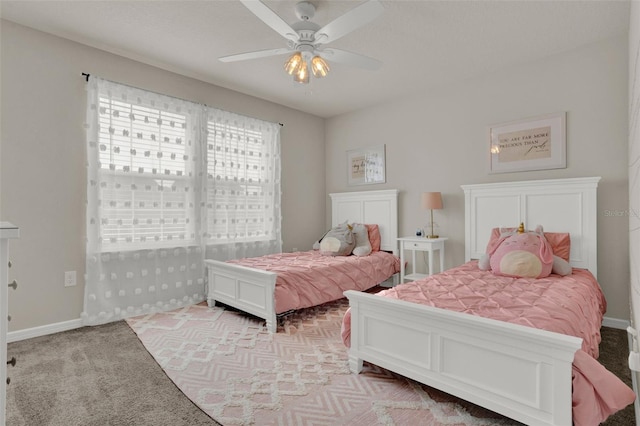 bedroom featuring carpet, ceiling fan, and baseboards