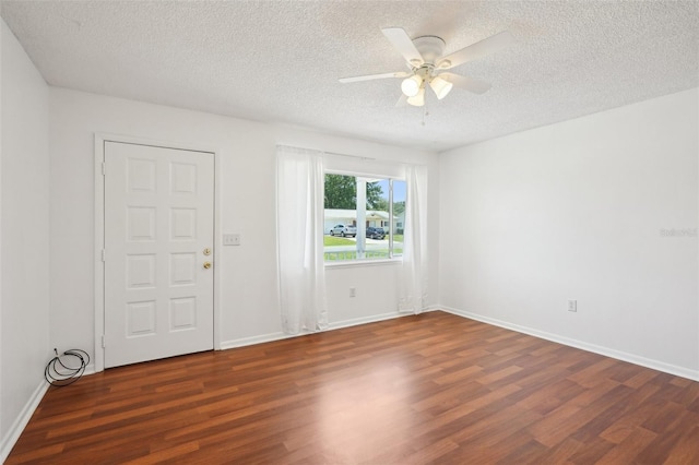 11214 SW 77th Ct, Ocala, FL 34476 - spare room featuring wood finished floors, a textured ceiling, ceiling fan, and baseboards