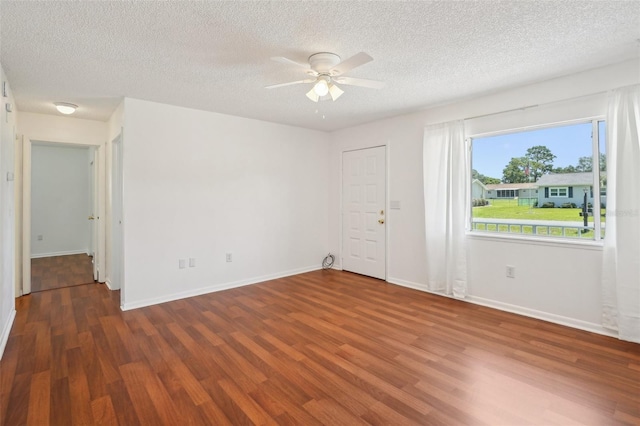 11214 SW 77th Ct, Ocala, FL 34476 - empty room featuring wood finished floors, ceiling fan, a textured ceiling, and baseboards