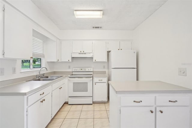 11214 SW 77th Ct, Ocala, FL 34476 - kitchen featuring white appliances, under cabinet range hood, a sink, and light countertops