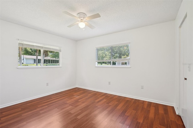 11214 SW 77th Ct, Ocala, FL 34476 - unfurnished room featuring wood finished floors, ceiling fan, baseboards, and a textured ceiling