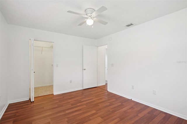 11214 SW 77th Ct, Ocala, FL 34476 - unfurnished bedroom featuring wood finished floors, baseboards, and a ceiling fan