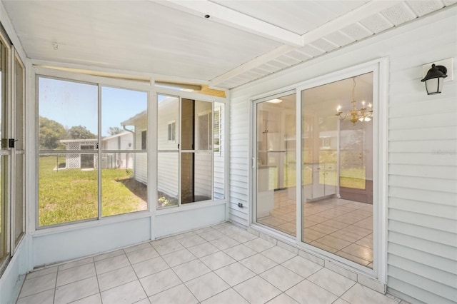 11214 SW 77th Ct, Ocala, FL 34476 - unfurnished sunroom featuring a chandelier