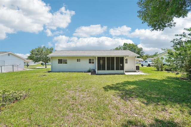 11214 SW 77th Ct, Ocala, FL 34476 - back of property featuring a sunroom and a yard